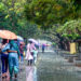 Kochi: Tourists walk under umbrellas during heavy rain at the Marine Drive walkway in Kochi on Thursday, May 29, 2025. (Photo: IANS)